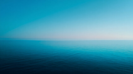 Obraz premium A serene view of the ocean meeting the sky with a gradient of blue and white colors in the horizon
