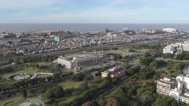 Aerial view of UBA university campus and surrounding Buenos Aires cityscape and green areas.