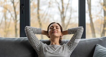 Relaxed woman resting on sofa in a sunlit cozy living room