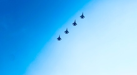 Blue sky gradient with airplanes flying in formation
