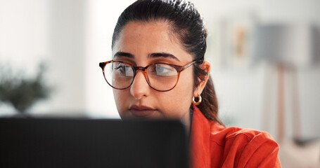 Glasses, laptop and remote work with woman in home office for research, blog writer and copywriting...