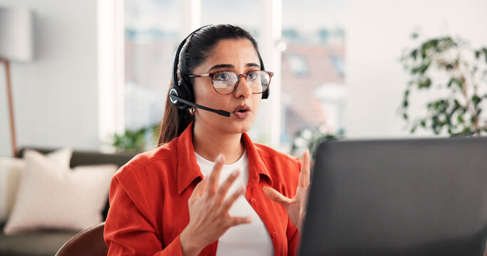Headset, laptop and video call with woman in home living room for discussion or planning. Computer, remote work and virtual meeting with Indian freelancer in apartment for contact, explain or update
