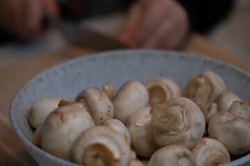 Fresh white mushrooms in bowl for cooking