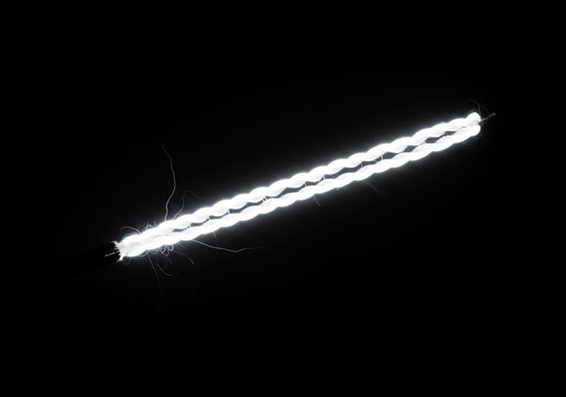 Intense white-hot filament glowing brightly, generating extreme heat and light, focused illumination creating lens flare and abstract bright energy ,filament ,energy ,incandescent - Powered by Adobe