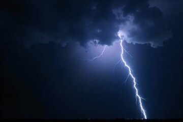 Dramatic electric discharge across a dark, stormy sky, illuminating the landscape with raw power. A powerful lightning bolt strikes down from a dark, swirling storm cloud, illuminating a dramatic