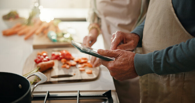 Senior, couple and hands with tablet for cooking recipe, online tutorial or meal prep in kitchen. Man, woman or research with technology, vegetables or ingredients for chef course or tips in home - Powered by Adobe
