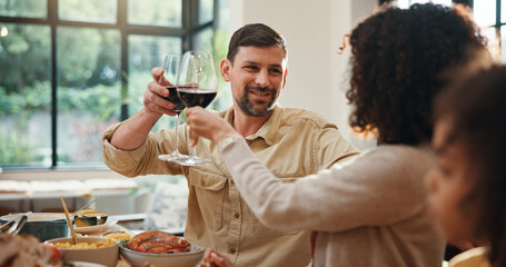 Christmas, toast and parents with wine, home or happy with meal in dining room, love and celebration. Xmas, cheers and people with alcohol for December holiday, gathering and party for festive season