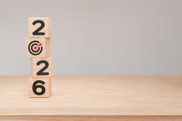 stack of 2026 with target icon on wooden cube, Happy new year 2026 with start new business goal concept, 3d render