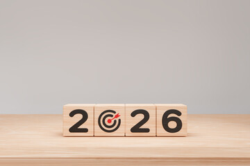 stack of 2026 with target icon on wooden cube, Happy new year 2026 with start new business goal concept, 3d render