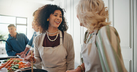 Cooking, help and family in kitchen for lunch, supper and prepare food for bonding in home. Culinary skills, social gathering and people for meal prep, cutting vegetables and thanksgiving dinner