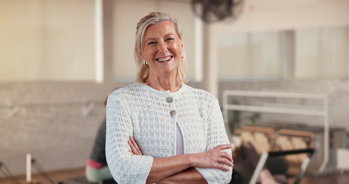 Portrait, mature woman and arms crossed for pilates, fitness pride and club manager. Happy, female person and confident for exercise course, training support and join us with membership for wellness