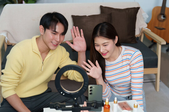 Cheerful Influencers Waving Goodbye in Video Stream