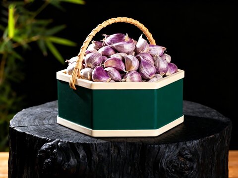A basket filled with purple garlic bulbs placed on a wooden stump against a dark background