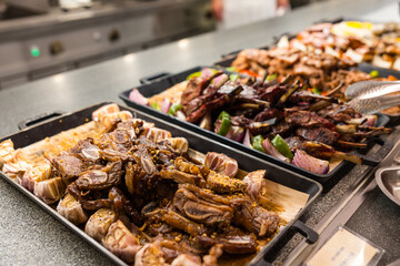 Grilled meat served at buffet restaurant table