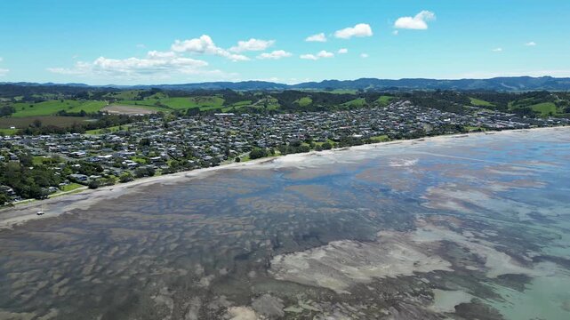 Drone Flight Towards Snells Beach Coastline and Hills, New Zealand