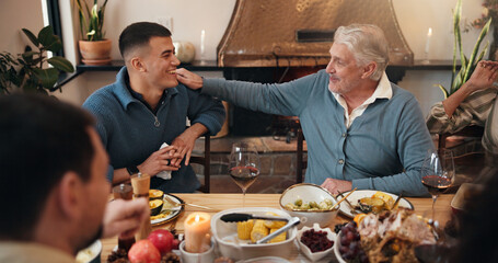 Conversation, laughing and man with father in dining room of home for Christmas feast together. Celebration, festive and funny with happy family in apartment for holiday season or social gathering