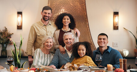 Thanksgiving, smile and portrait with family in dining room for holiday season, dinner or tradition. Festive feast, party and event with people eating in home for food, hosting and hospitality