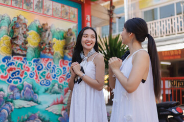 Young asian women enjoying cultural temple visit