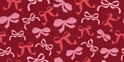 Seamless pattern of pink and red bows on a dark red background. Holiday or celebration concept for wrapping paper or gift card designs.