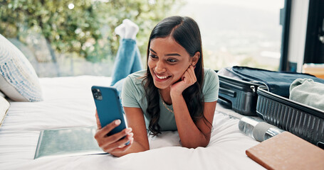 Phone, video call and happy woman with luggage on bed, travel vacation or connection for online...