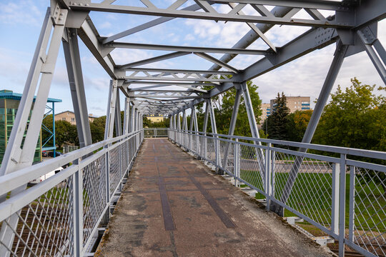 Metal pedestrian bridge over railway tracks in Narva, Estonia.