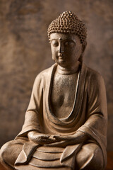 Meditating Buddha Statue on dark background. Soft focus. Close up. Copy space	