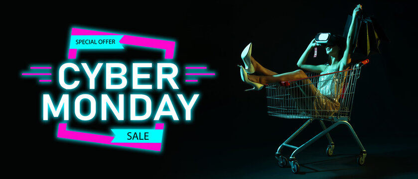 Young woman with VR glasses in shopping cart on dark background. Cyber Monday - Powered by Adobe