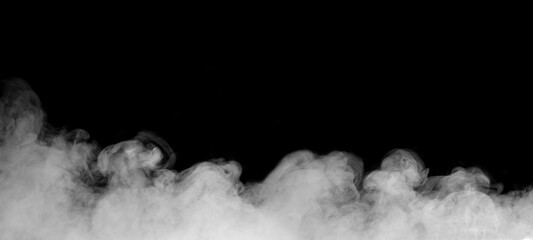 White smoke or fog drifting on black background, creating an abstract and atmospheric texture. Ideal for design overlays, video effects, or creative backgrounds in digital and cinematic projects.