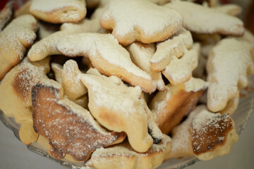 Sweet pastries sprinkled with powdered sugar. Delicious food. Made at home.