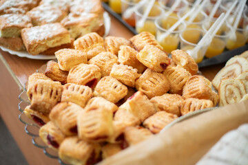 Baking dough on the table. Delicious food at the fair. Homemade cakes for guests.
