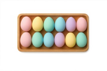 Pastel colored easter eggs on wooden tray