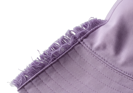 Extreme macro of a light purple textile bucket hat, deconstructed to reveal supple fabric, frayed edges, and interwoven fibers on a transparent background, exploration of textile craftsmanship
