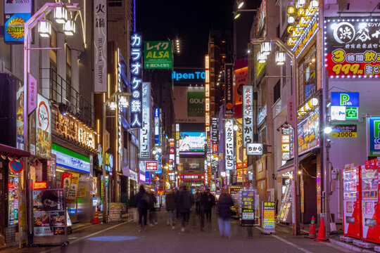 Bright colorful neon advertistment billboards and signs located in Shinjuku Japan. Photo taken in the evening at night