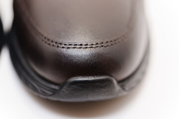 Close-up view of a brown shoe in natural lighting