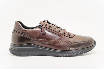 Stylish brown leather sneakers with zipper detail