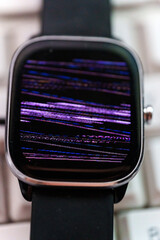 Obraz premium Smartwatch screen showing digital distortion and colors