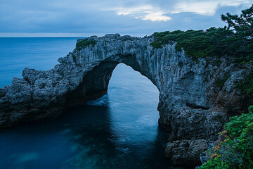 The natural stone arch of the Engetsu Island in Japan during twilight