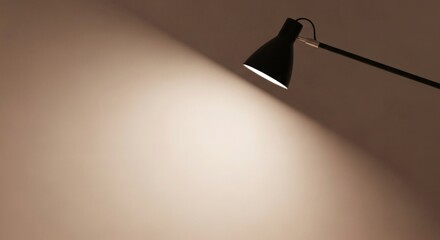 A spotlight of inspiration from a modern table lamp illuminates a neutral surface, symbolizing focus, clarity, and creativity in a workspace