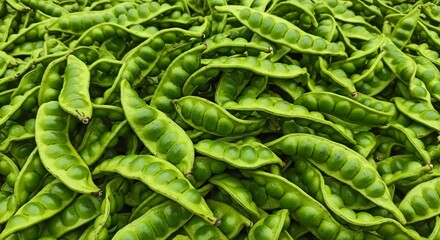 Abundant Pile of Fresh Green Stink Bean Pods in Close-up View