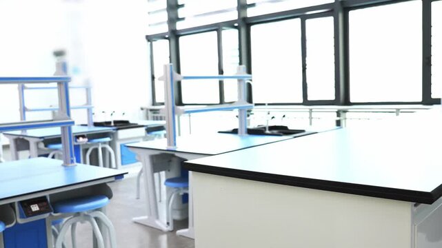 Modern empty science laboratory with blue desks of the school