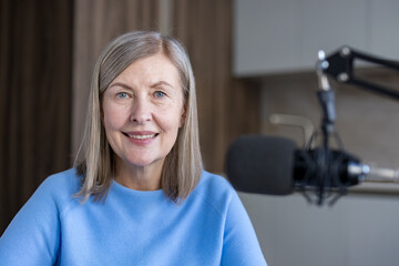 Senior woman hosts an online radio podcast, creating engaging content and sharing her voice with an audience, embracing modern communication technology with a warm smile