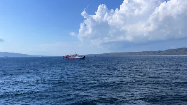 Bali, Indonesia - August 27, 2025: Car and passenger ferries cross the Bali Strait from Gilimanuk Harbor to Ketapang Harbor. View of the strait from the ferry deck. 4К