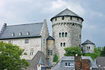 Fototapeta premium Scenic fortress castle of Stolberg featuring cylindrical towers. Symbolizes medieval stronghold presence, German cultural heritage, Rhineland heritage monument, and timeless architectural beauty.