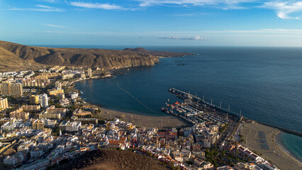 Panorama of the town of Los Cristianos with a volcano in the background. Tenerife, Canary Islands