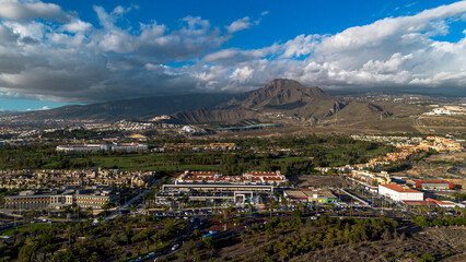 Obraz premium Panorama of the town of Los Cristianos with a volcano in the background. Tenerife, Canary Islands
