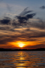 Obraz premium Dramatic summer sunset over Lake Mitkow in Poland. Evening landscape.