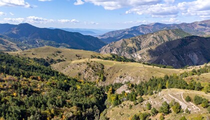 Naklejka premium Aerial view of mountain valley showing vast natural terrain and scenic wilderness