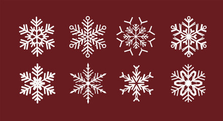 Collection of eight intricate white snowflakes with unique crystalline patterns.