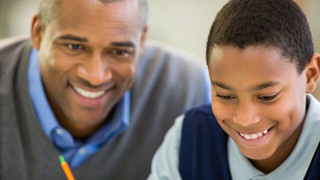 A father and son share a joyful moment while studying together, showcasing a strong bond and positive learning environment.