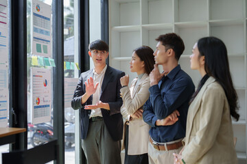 Business team discussing financial data charts in meeting